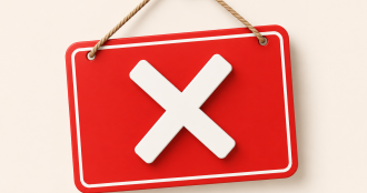 Un’insegna rossa minimalista con una grande “X” bianca sospesa da una corda, simbolo di chiusura o indisponibilità del servizio.